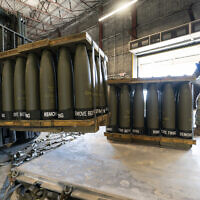 Illustrative: US Air Force Staff Sgt. Cody Brown, right, with the 436th Aerial Port Squadron, checks pallets of 155 mm shells ultimately bound for Ukraine, at Dover Air Force Base, Delaware, April 29, 2022. The Biden administration has announced another $1 billion in new military aid for Ukraine. (Alex Brandon/AP)