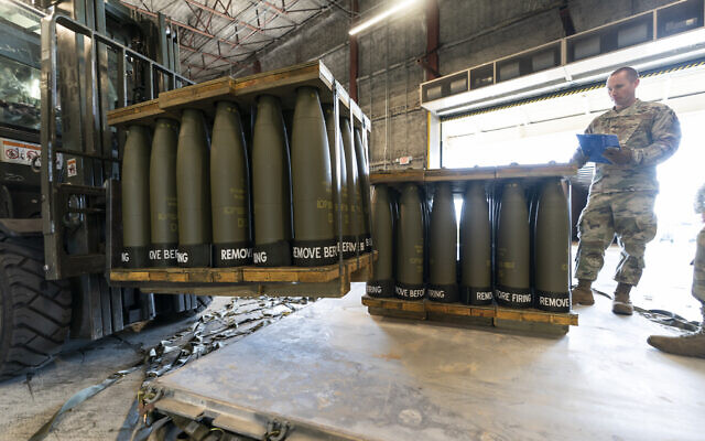 Illustrative: US Air Force Staff Sgt. Cody Brown, right, with the 436th Aerial Port Squadron, checks pallets of 155 mm shells ultimately bound for Ukraine, at Dover Air Force Base, Delaware, April 29, 2022. The Biden administration has announced another $1 billion in new military aid for Ukraine. (Alex Brandon/AP)