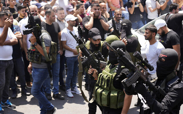 Palestinian gunmen attend the funeral for Ibrahim Nabulsi and two others killed in the West Bank city of Nablus, August 9, 2022. (AP Photo/Majdi Mohammed)