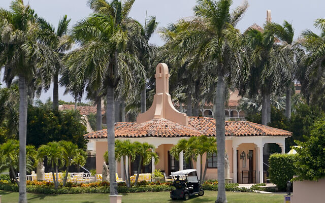 Security moves in a golf cart at former president Donald Trump's Mar-a-Lago estate, August 9, 2022, in Palm Beach, Florida. (AP Photo/Lynne Sladky)