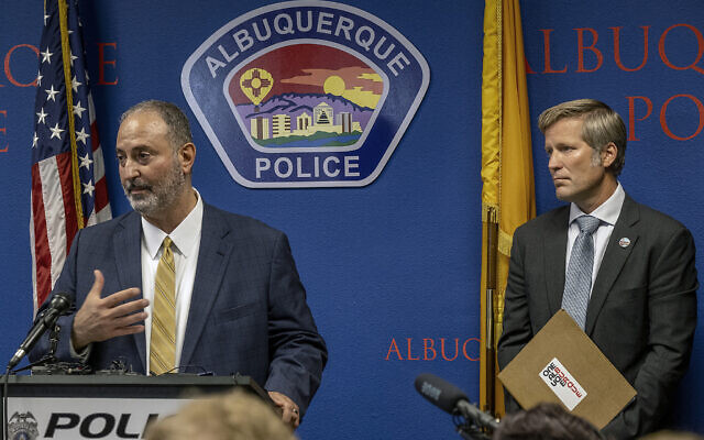 Ahmad Assed, president of the Islamic Center of New Mexico, left, speaks at a news conference to announce the arrest of Muhammad Syed as Albuquerque Mayor Tim Keller listens, at right, August 9, 2022. (Adolphe Pierre-Louis/The Albuquerque Journal via AP)