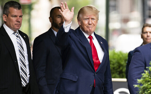 Former President Donald Trump waves as he departs Trump Tower, August 10, 2022, in New York, on his way to the New York attorney general's office for a deposition in a civil investigation. (AP Photo/Julia Nikhinson)
