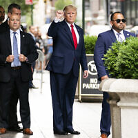 Former US president Donald Trump gestures as he departs Trump Tower, Wednesday, August 10, 2022, in New York, on his way to the New York attorney general's office for a deposition in a civil investigation. (AP/Julia Nikhinson)