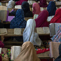 Afghan girls read the Quran in the Noor Mosque outside the city of Kabul, Afghanistan, August 3 2022. (AP/Ebrahim Noroozi)