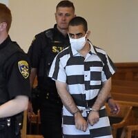 Hadi Matar, 24, arrives for an arraignment in the Chautauqua County Courthouse in Mayville, New York, August 13, 2022. Matar is accused of carrying out a stabbing attack against 'Satanic Verses' author Salman Rushdie. (AP Photo/Gene J. Puskar)