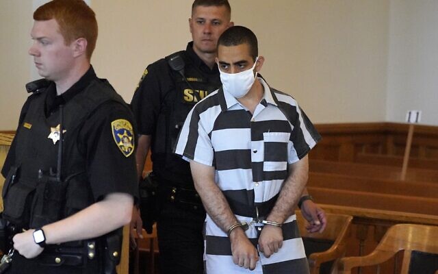 Hadi Matar, 24, arrives for an arraignment in the Chautauqua County Courthouse in Mayville, NY., Saturday, August 13, 2022. Matar, accused of carrying out a stabbing attack against 'Satanic Verses' author Salman Rushdie has entered a not-guilty plea in a New York court on charges of attempted murder and assault. (AP Photo/Gene J. Puskar)