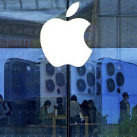 Illustrative: People shop at an Apple Store in Beijing, September 28, 2021. (AP Photo/Andy Wong, File)