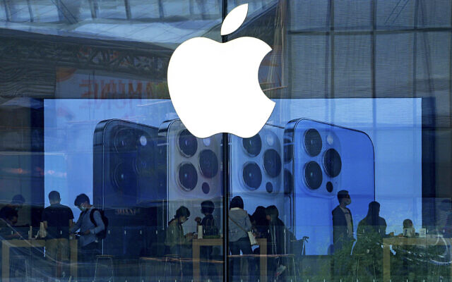 Illustrative: People shop at an Apple Store in Beijing, September 28, 2021. (AP Photo/Andy Wong, File)