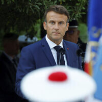 French President Emmanuel Macron attends a ceremony marking the 78th anniversary of the Allied landings in Provence during World War II, which helped liberate southern France, in Bormes-les-Mimosas, August 19, 2022. (Eric Gaillard, Pool via AP)