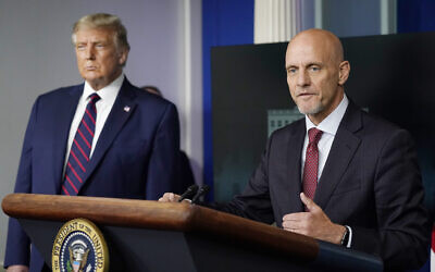 Then-US president Donald Trump listens as Dr. Stephen Hahn, at the time commissioner of the US Food and Drug Administration, speaks during a media briefing in the James Brady Briefing Room of the White House, in Washington, August 23, 2020. (Alex Brandon/AP)