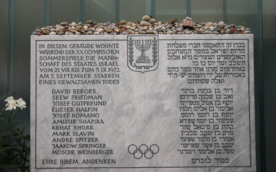 A memorial plaque for the eleven athletes from Israel and one German police officer were killed in a terrorist attack during the Olympic Games 1972, stands at the former accommodation of the Israeli team in the Olympic village in Munich, Germany, August 27, 2022.  (AP/Matthias Schrader)