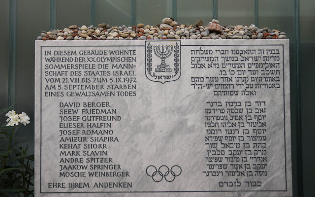 A memorial plaque for the eleven athletes from Israel and one German police officer were killed in a terrorist attack during the Olympic Games 1972, stands at the former accommodation of the Israeli team in the Olympic village in Munich, Germany, August 27, 2022.  (AP Photo/Matthias Schrader)