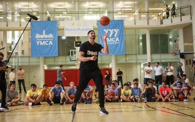 Enes Kanter Freedom leads at a basketball camp in Jerusalem's YMCA, July 31, 2022. (SoulShop Studios)