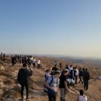 Settlers from the ultra-Orthodox illegal outpost of Derech Emunah leave their settlement after it was evacuated and destroyed by border police and Civil Administration personnel in the early hours of Wednesday morning, August 17, 2022. (Screenshot courtesy Derech Emunah residents)