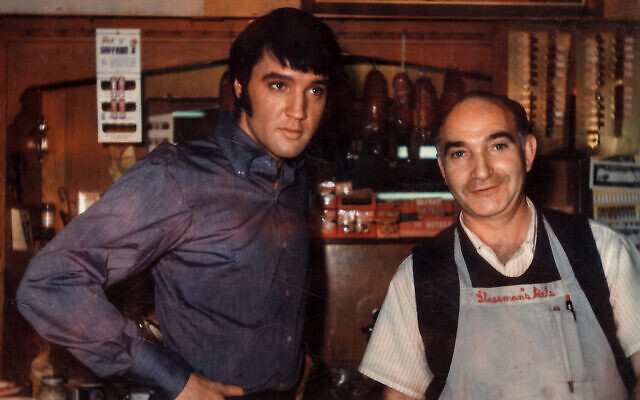 Elvis Presley with deli employee Joe Guss at Glassman’s Deli and Market, Los Angeles, 1969. (From the Bonar
Family Collection/ Skirball Center)