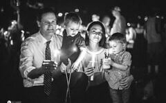 The author with her husband, then-Charlottesville-Mayor Mike Signer, and their children at a vigil commemorating the violent, 2017 'Unite the Right' event in Charlottesville, Virginia. (Courtesy)