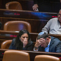 Former Minister of Religious Affairs Matan Kahana speaks withIsraeli minister of Internal Affairs Ayelet Shaked during a plenum session in the assembly hall of the Israeli parliament on May 16, 2022. (Olivier Fitoussi/FLASH90)