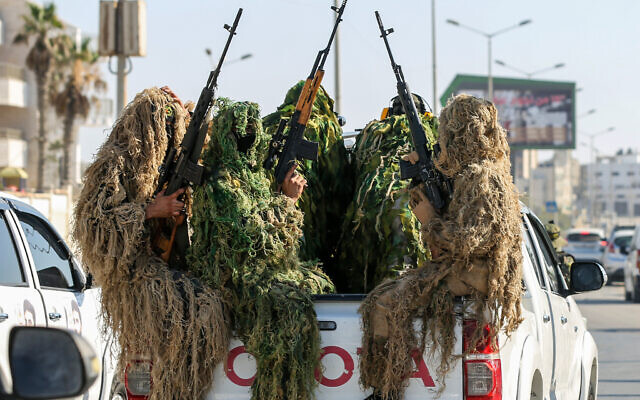 Members of the Saraya al-Quds Brigades, the armed wing of the Palestine Islamic Jihad movement, take part in a military parade. in Al-Shati refugee camp, west of Gaza City, on June 24, 2022. (Attia Muhammed/Flash90)