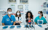 Dr. Rey Biton (second from right), head of the Mirsham organization of medical residents, holds a press conference at Assuta Medical Center in Ashdod, August 1, 2022. (Flash90)