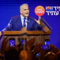 Prime Minister and Yesh Atid chairman Yair Lapid speaks to party activists during a Yesh Atid party conference in Tel Aviv, August 3, 2022. (Avshalom Sassoni/Flash90)