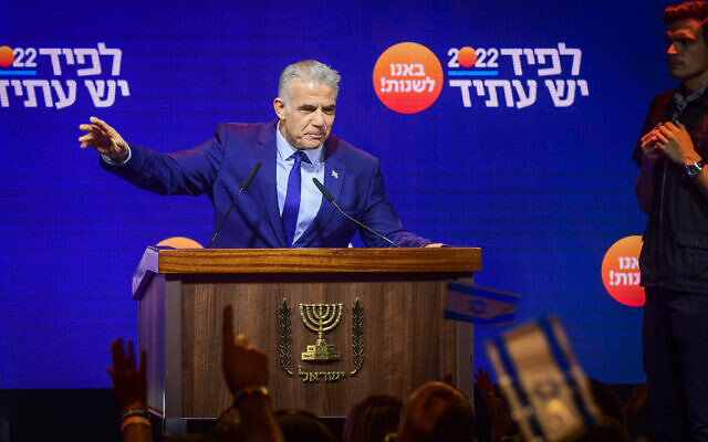 Prime Minister and Yesh Atid chairman Yair Lapid speaks to party members during a Yesh Atid party conference in Tel Aviv, August 3, 2022. (Avshalom Sassoni/Flash90)