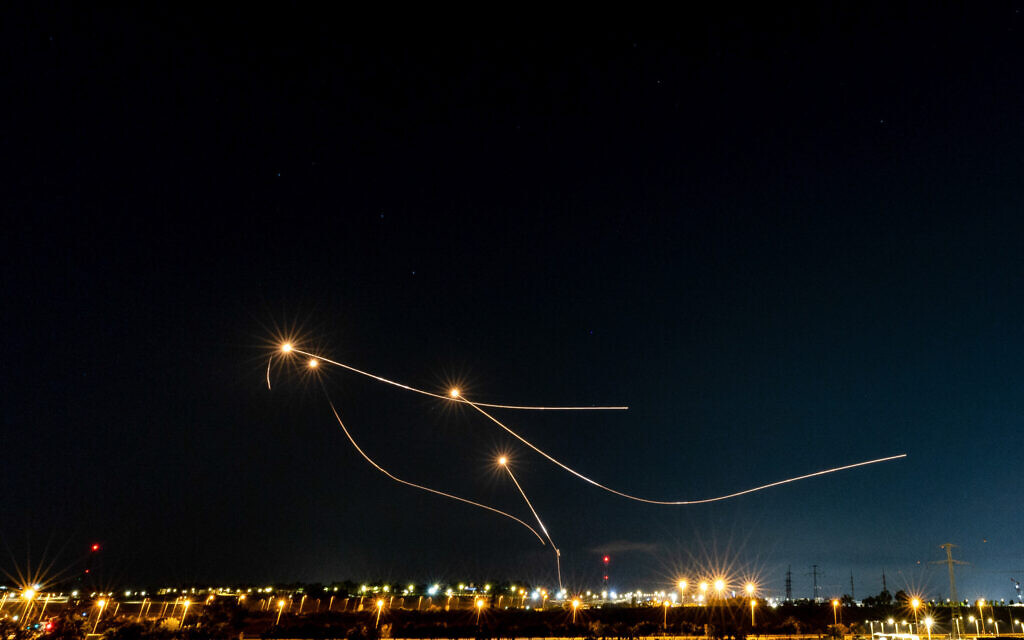 The Iron Dome anti-missile system fires interception missiles as rockets are fired from the Gaza Strip to Israel, as seen from Sderot, August 7, 2022. (Yonatan Sindel/Flash90)