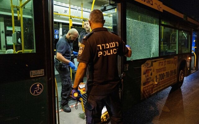 Police inspect the scene of a suspected terror shooting outside Jerusalem’s Old City, August 14, 2022. (Yonatan Sindel/Flash90)