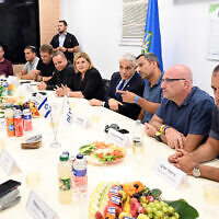 Prime Minister Yair Lapid meets with southern municipal leaders in Sderot, August 7, 2022, during the fighting in Gaza between Israel and Palestinian Islamic Jihad. (Haim Zach/GPO)