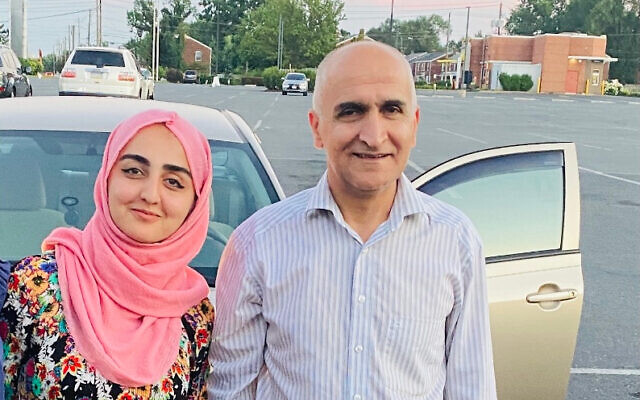 Afghan evacuee Hadiya and her father Mirwais after being resettled in 2021 in Harrisburg, Pennsylvania through a joint initiative of the Jewish Federations of North America and the Shapiro Foundation. (Courtesy)
