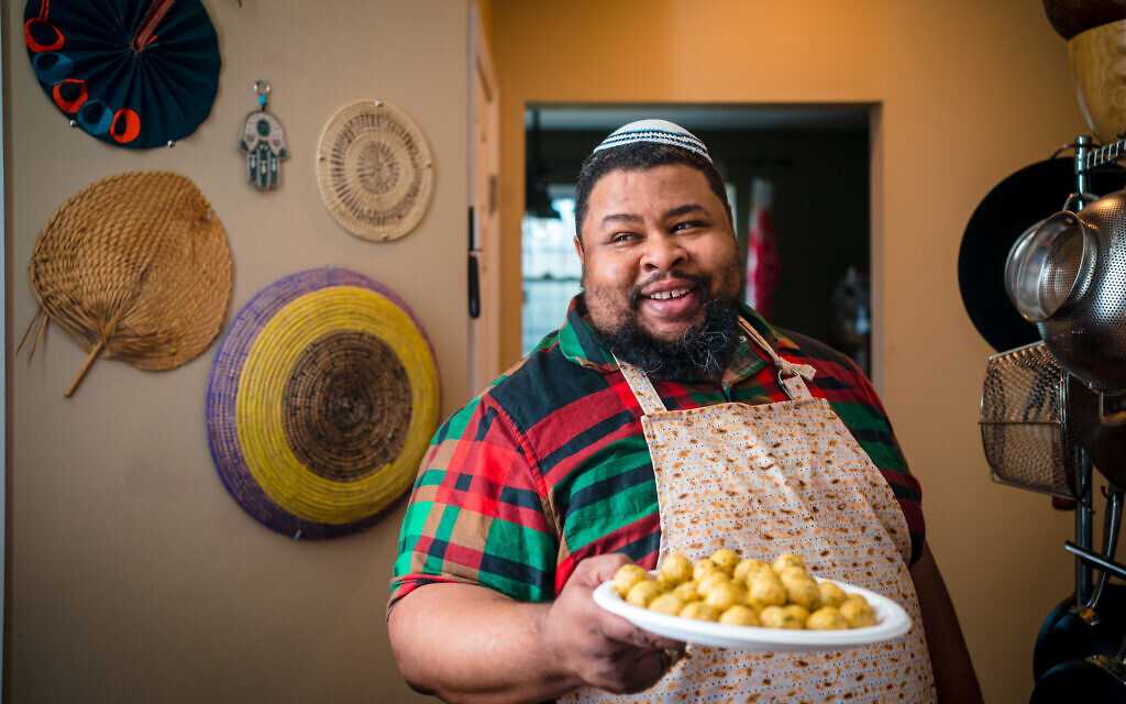 Michael W. Twitty prepares matzah balls with ginger and cayenne pepper for Passover, April 2022. (Johnny Shryock)