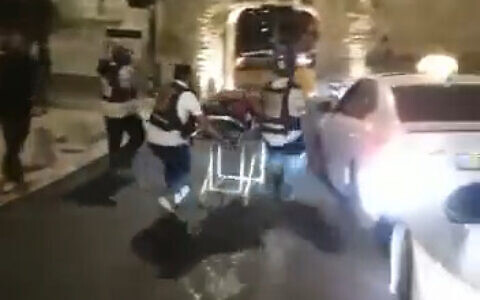 Medics transport a wounded person from Jerusalem's Old City after a shooting, August 14, 2022. (Screenshot: Twitter)