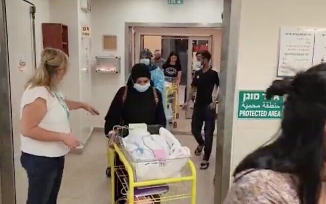 Staff at Soroka Hospital in Beersheba evacuate babies to protected wards on August 5, 2022. (Screen capture/Twitter)