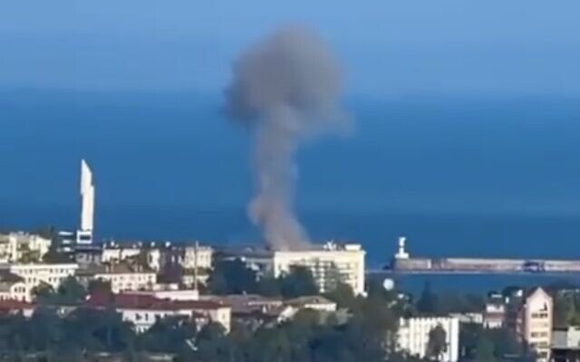 A screenshot of video from social media purporting to show a blaze on the roof of Russia's Black Sea fleet headquarters, in Sevastopol, Russian-annexed Crimea, August 2022. The governor of Sevastopol said the drone was downed and then crashed into the roof, sparking the fire. (Screen capture: Twitter)