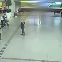 An image taken from security camera footage at an airport believed to show and Iranian agent (C) monitoring Israeli tourists in turkey in July 2022 (Screen capture/Channel 12)