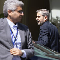 Iran's chief nuclear negotiator Ali Bagheri Kani, at right, arrives at the Coburg Palais, the venue of the Joint Comprehensive Plan of Action (JCPOA) talks in Vienna on August 4, 2022. (Alex Halada/AFP)