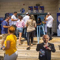 Likud party members arrive to cast their votes in the party primaries at a polling station in Ashdod on August 10, 2022. (Flash90)