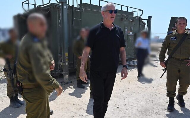 Defense Minister Benny Gantz tours an Iron Dome battery in southern Israel, August 6, 2022. (Nicole Laskavi/Defense Ministry)