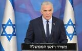 Prime Minister Yair Lapid delivers a message a day after the close of Operation Breaking Dawn, from the Israel Defense Forces' Tel Aviv headquarters, August 8, 2022. (Amos Ben Gershom / GPO)