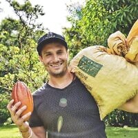 Moka Origins CEO Jeff Abella with a cacao pod (right hand) and sack of coffee beans (Courtesy)