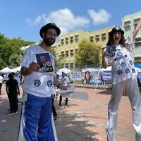 Performers on stilts welcome Likud primary voters in Rishon Lezion, August 10, 2022 (Carrie Keller-Lynn/Times of Israel)