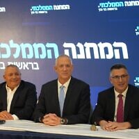 The leaders of the new National Unity party at the party launch on Sunday night, August 14, 2022, in Kfar Maccabiah, from left to right: Gadi Eisenkot, Defense Minister Benny Gantz and Justice Minister Gideon Sa’ar. (Elad Malka)