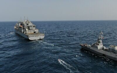 File: An Israeli Navy Sa'ar 5 corvette approaches a US Fifth Fleet replenishment tanker in the Red Sea, in an image published by the military on April 5, 2022. (Israel Defense Forces)