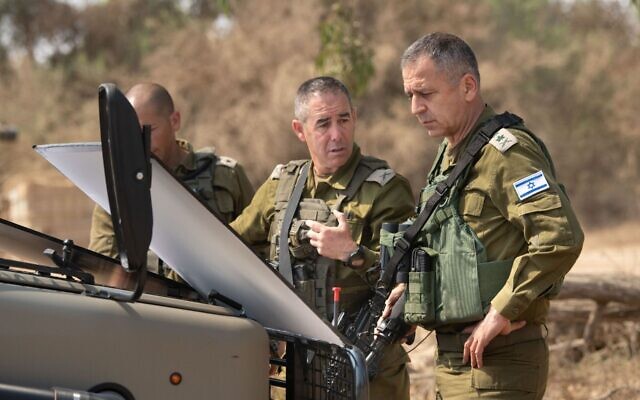 IDF chief Aviv Kohavi (right) speaks with Nimrod Aloni, chief of the Gaza Division, near the border with the Gaza Strip, August 4, 2022. (Israel Defense Forces)