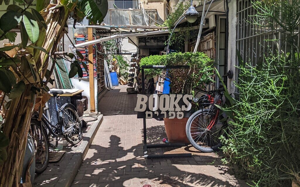 The alleyway leading towards Halper's Bookstore on 87 Allenby St. in Tel Aviv on July 6, 2022. (Melanie Lidman/Times of Israel)