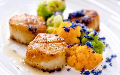 An illustrative photo of seared scallops. (Photo by Connie Perez on Unsplash)