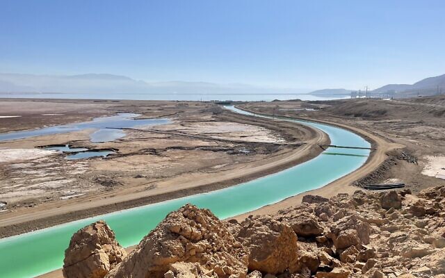 A canal that takes water pumped from the Dead Sea uphill to evaporation pools at the Dead Sea Works. (Sue Surkes/Times of Israel)