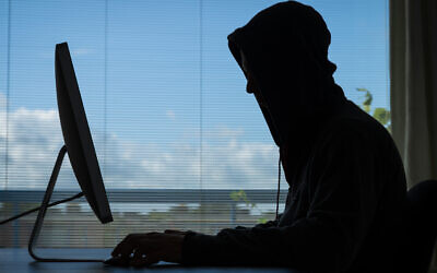 An illustrative photo of a person on a desktop (SanderStock via iStock by Getty Images)