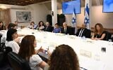 Prime Minister Yair Lapid and staff from the Prime Minister's Office learn what relevant ministries are doing to prepare for climate change at the Kirya in Tel Aviv, on August 31, 2022. (Haim Zach, GPO)