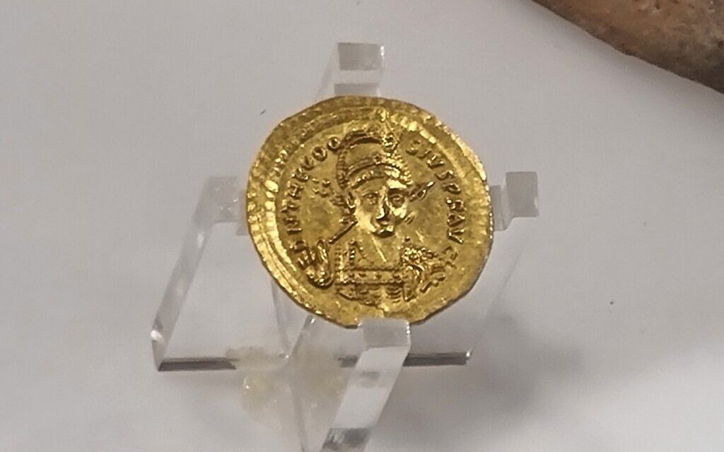A coin from circa 425 CE with the face of the Roman/Byzantine Emperor Theodosius II, on display at the Sanhedrin Exhibition. (Shmuel Bar-Am)
