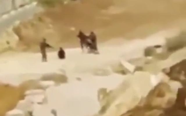 Israeli soldiers from the religious ‘Netzah Yehuda’ battalion are seen beating two Palestinian detainees in the West Bank, in a video published to TikTok on August 15, 2022. (Screenshot: TikTok)